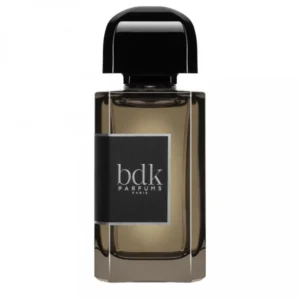 Dark glass bottle with a black label and a round cap